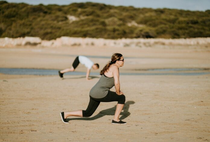 Photo by Annie Spratt woman wearing grey tank top doing exercise