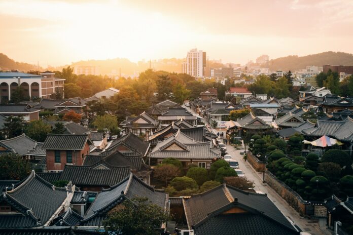 Photo by rawkkim aerial view photography of houses during golden hour