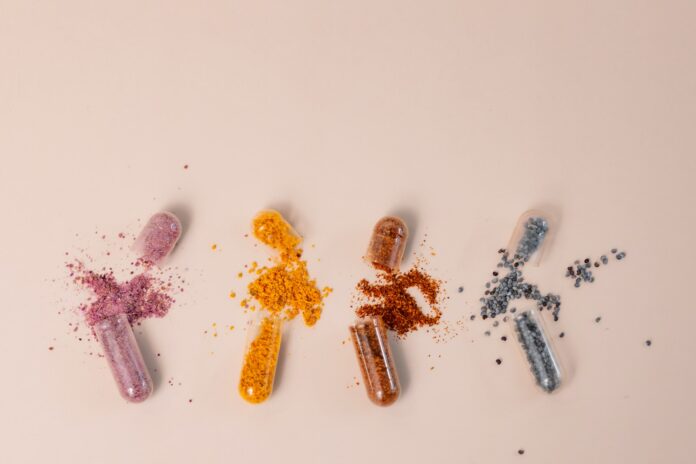 Photo by laura adai A group of pills sitting next to each other